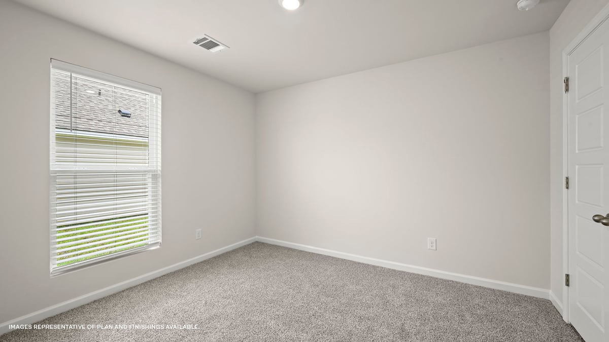 third bedroom with single window and room for a full or queen bed