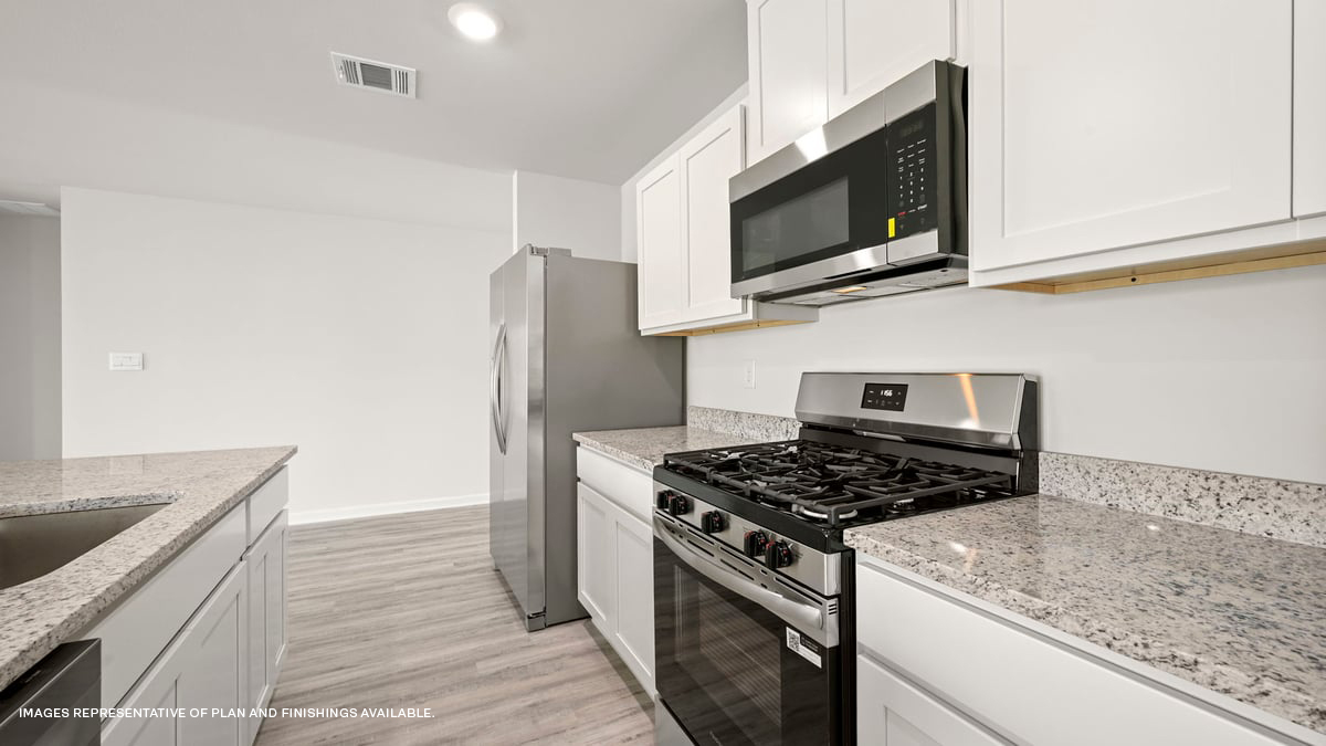 white kitchen island with stainless steel appliances