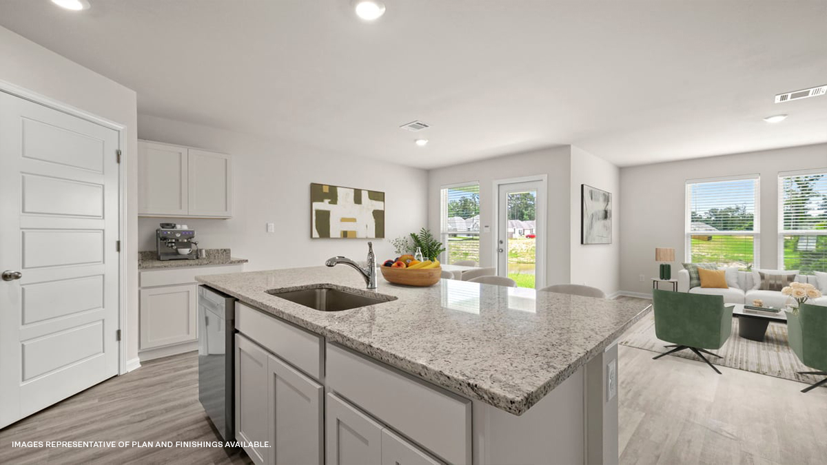 open concept kitchen with dining access