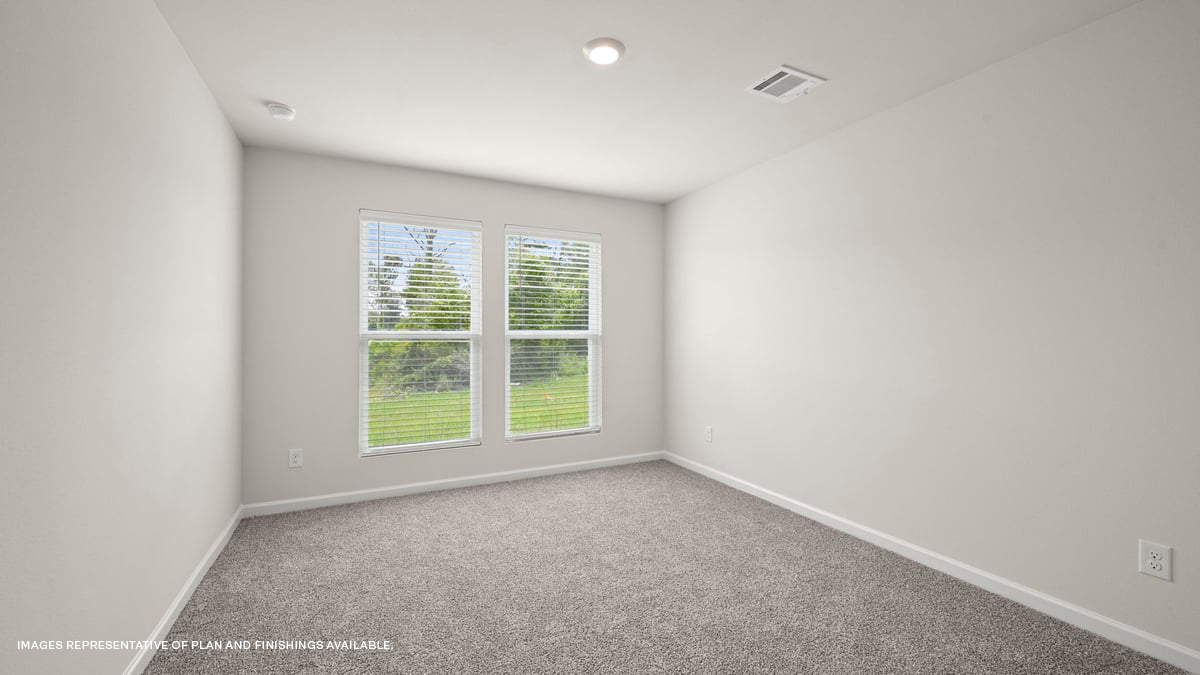 primary bedroom with room for a king-sized bed and two panel window