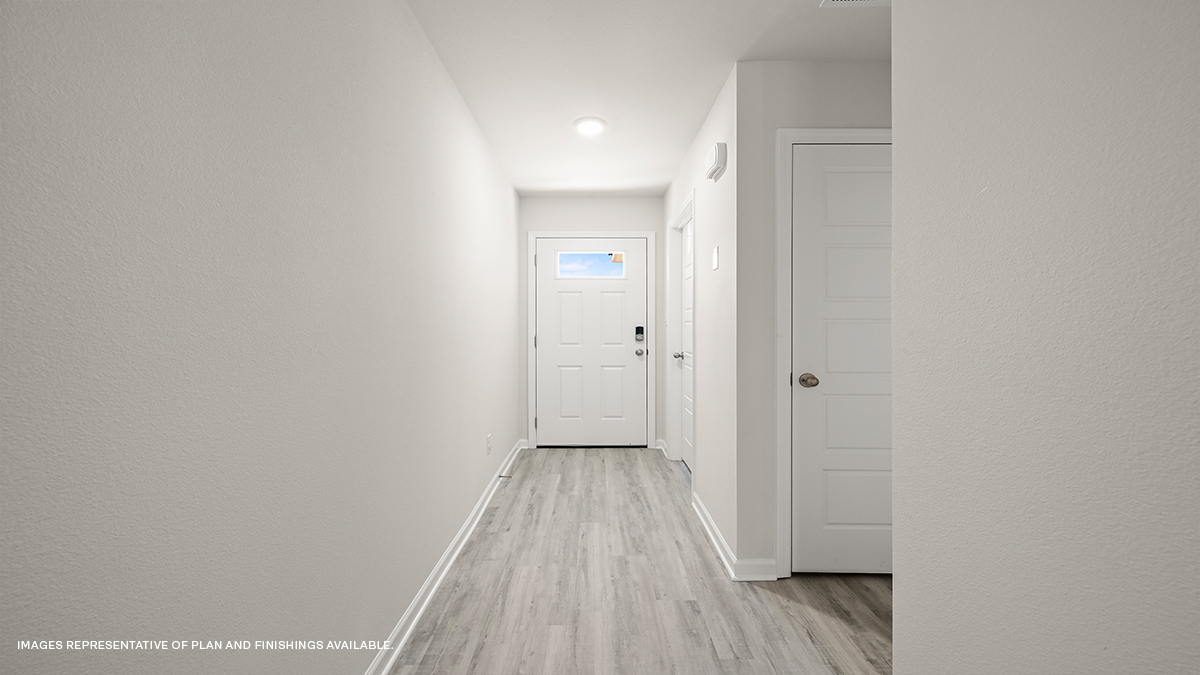 hall with two closets near second bathroom