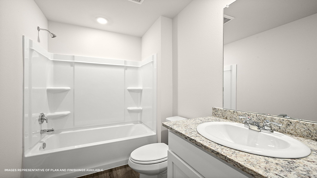 Guest bathroom with single vanity mirror and shower tub combo