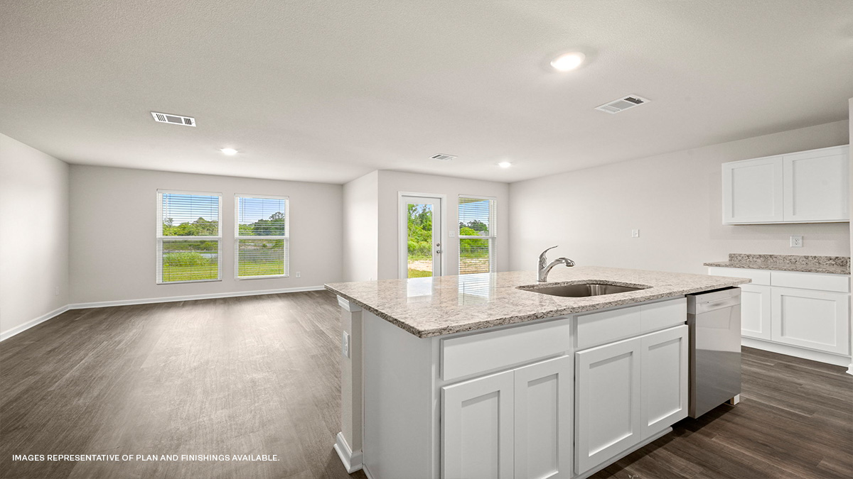 White kitchen island with open-concept living space