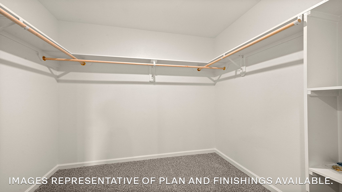 walk in closet in primary bedroom