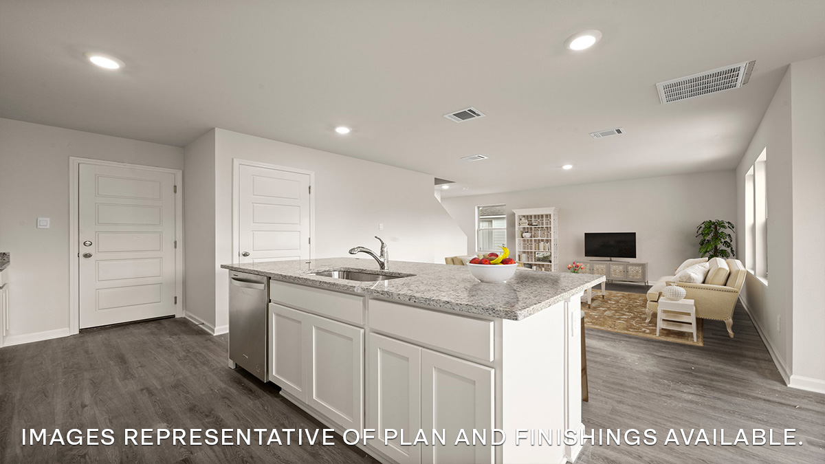 white kitchen island with open living space in the rear