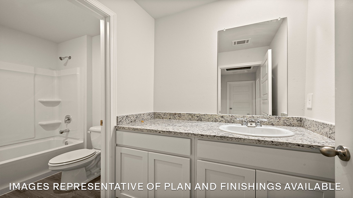 guest bathroom with vanity and shower tub combo