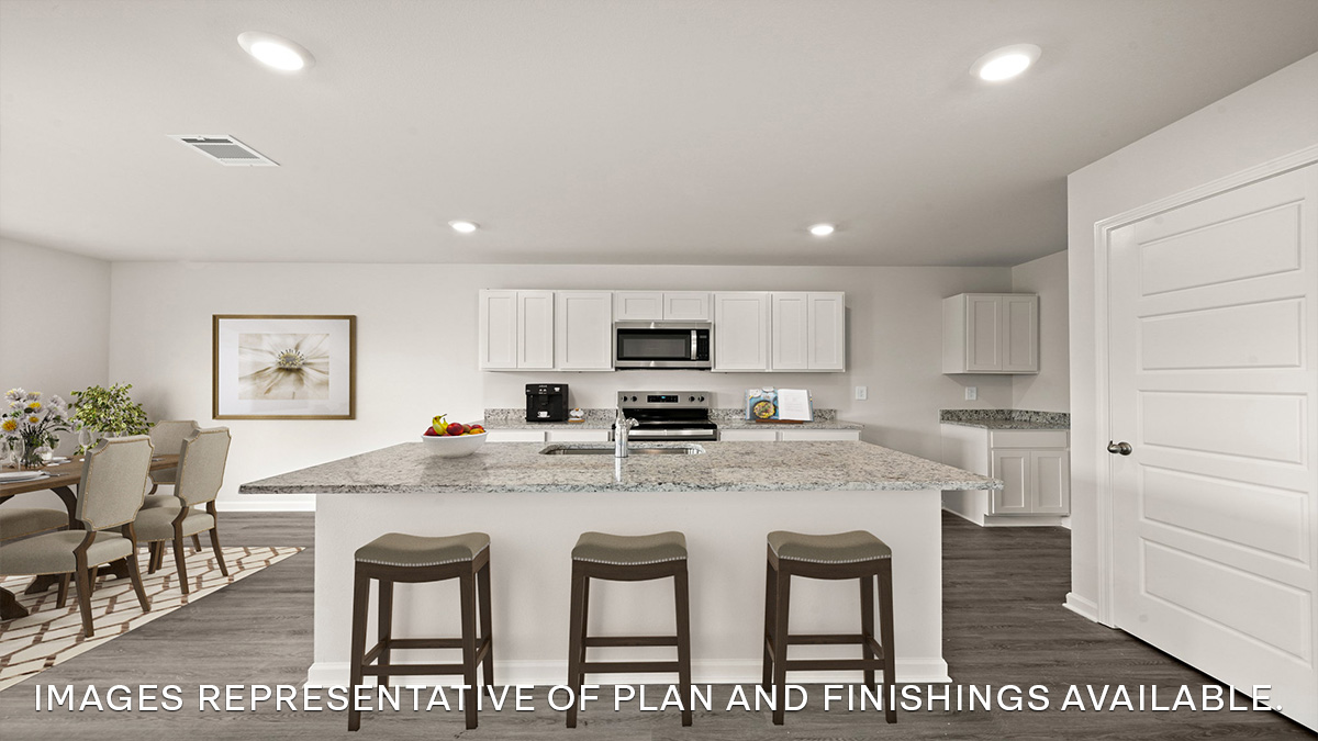 white kitchen island with stainless steel appliances