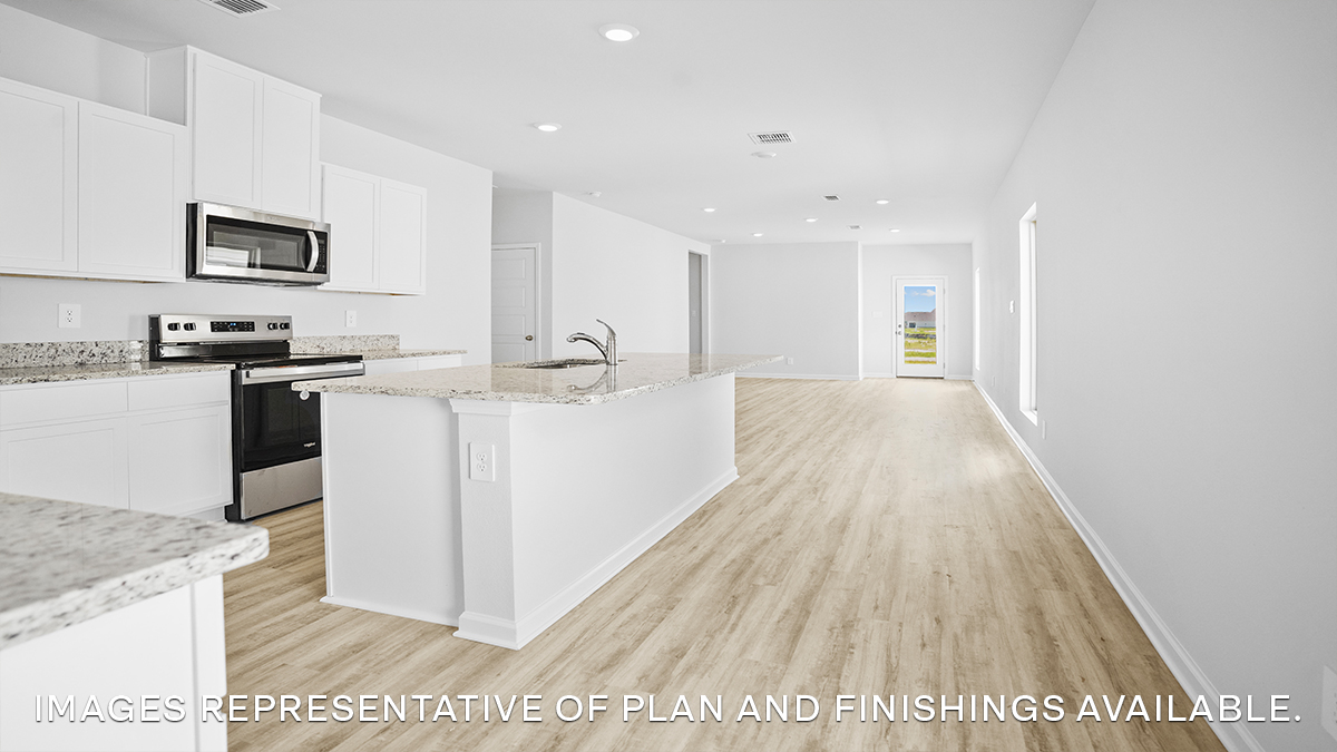 White kitchen island with stainless steel appliances and stools and open-concept living and dining