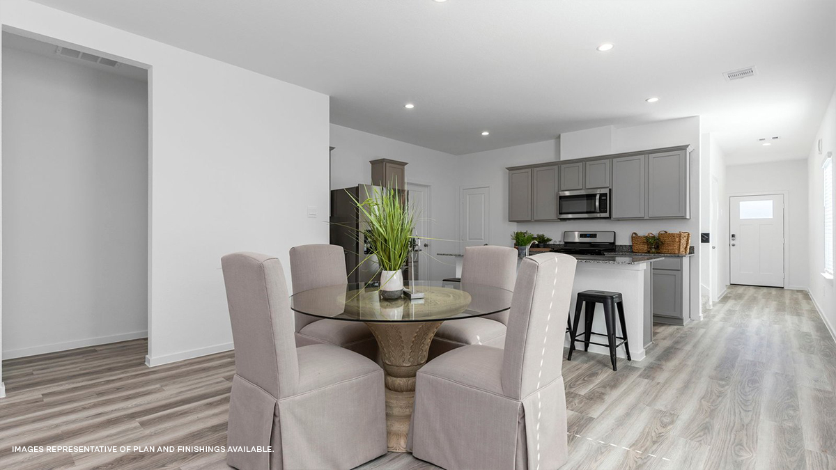 Gray kitchen island with dining space and foyer