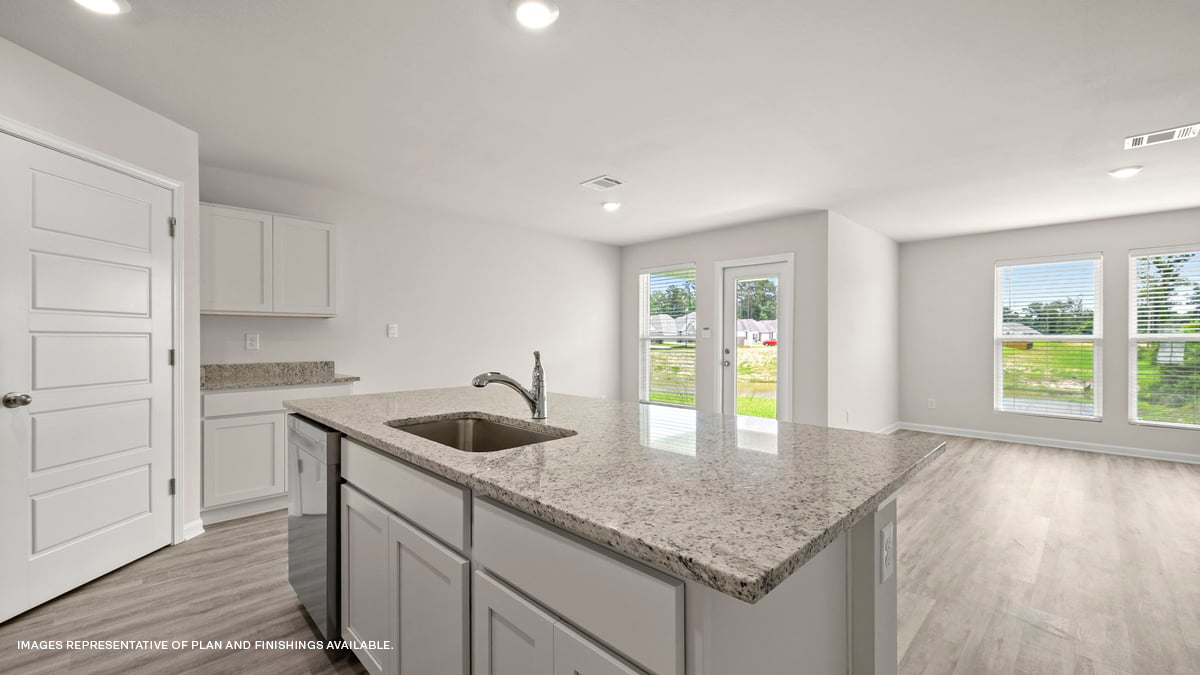 open concept kitchen with dining access