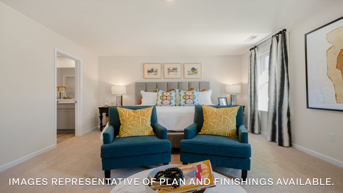 primary bedroom with king size bed and dual windows