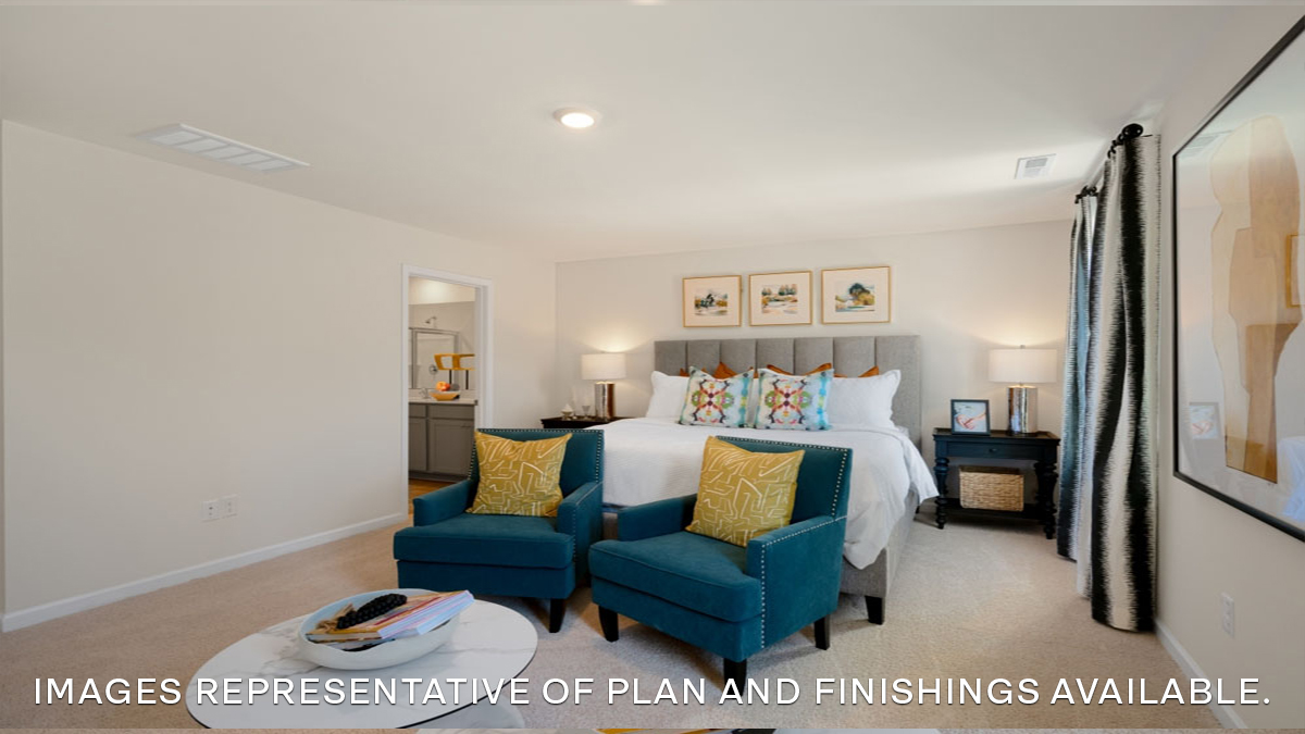 primary bedroom with king size bed and dual windows