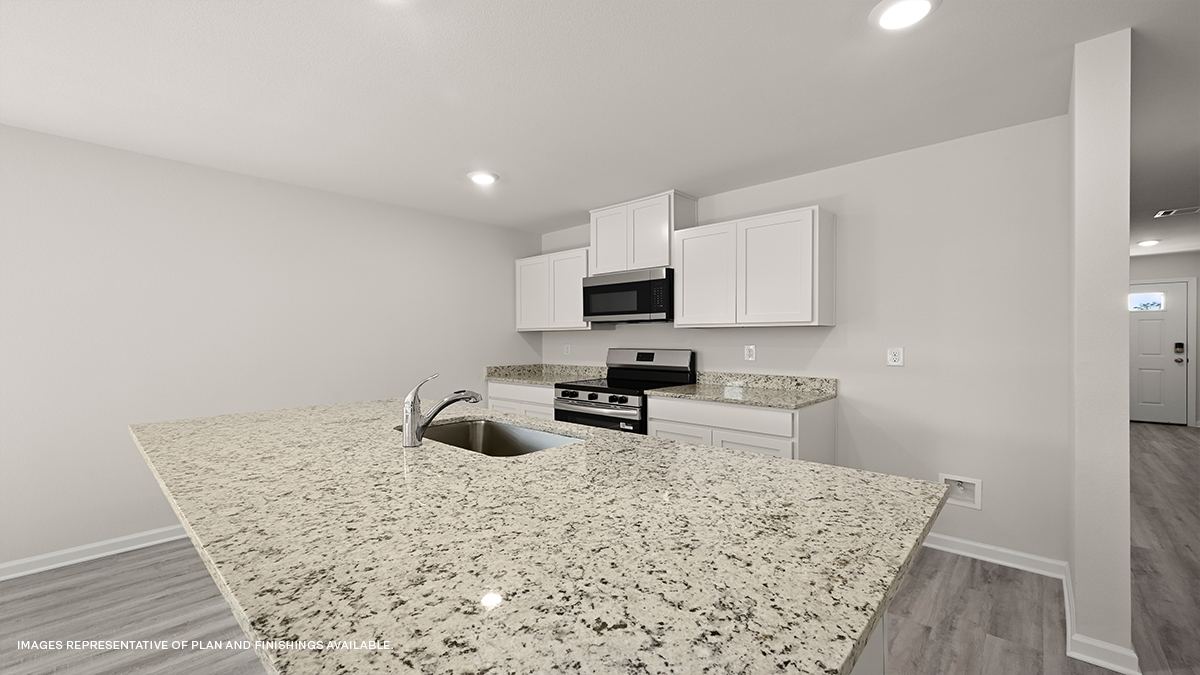 white kitchen island with stainless steel appliances