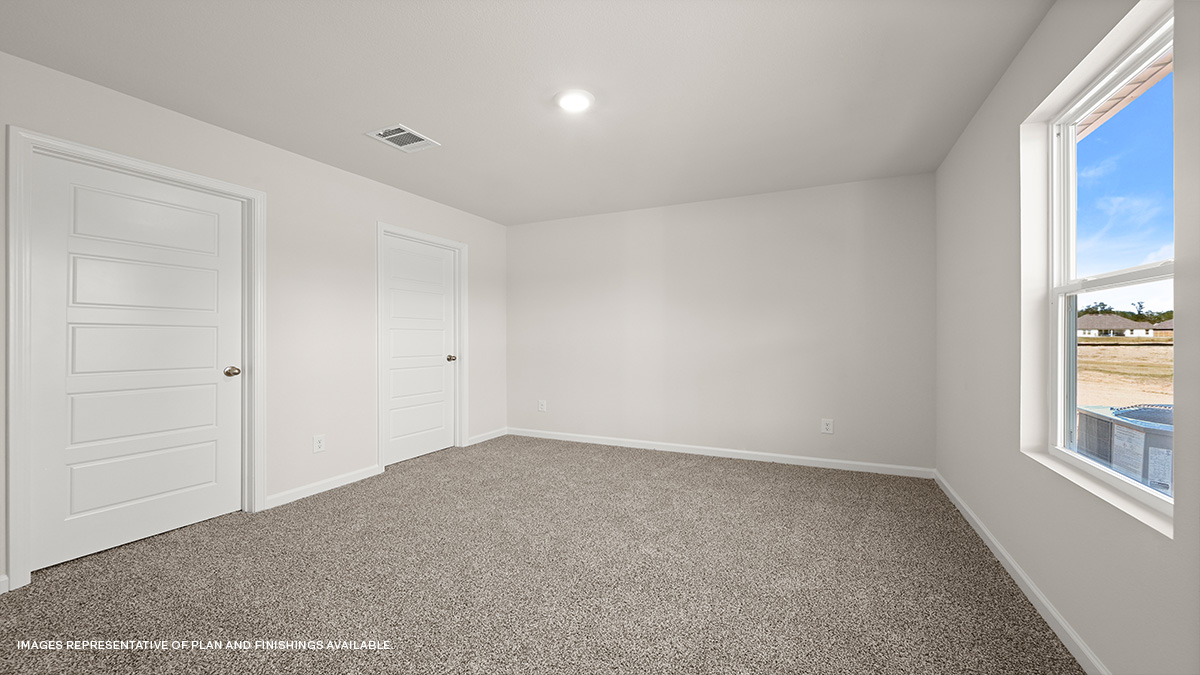 primary bedroom with single window and space for a king size bed set