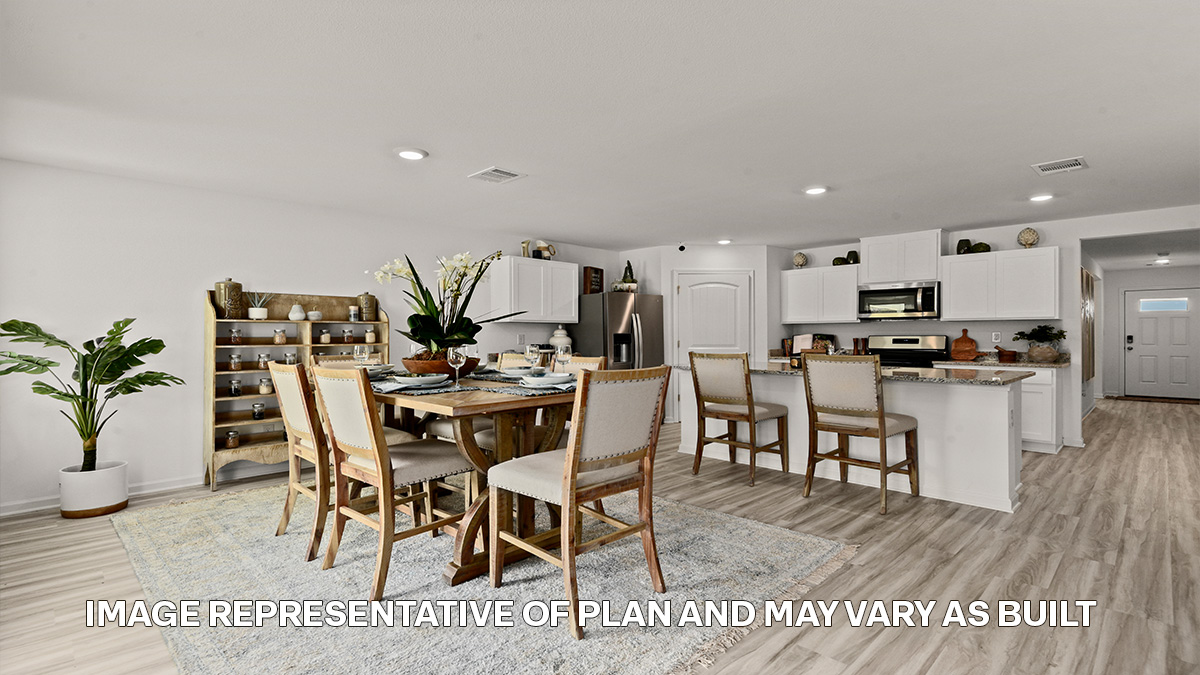 white kitchen island cabinets with stainless steel appliances and stools and access to dining and living room