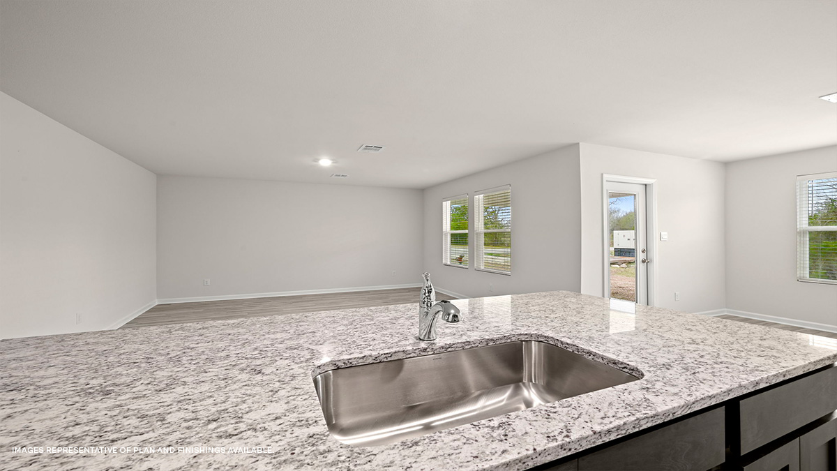 Dark grey kitchen island overlooking living room
