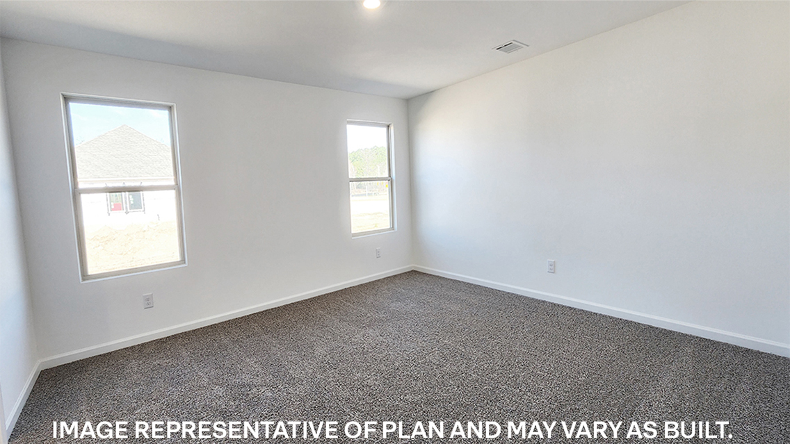 primary bedroom with room for a king-sized bed and rear facing window