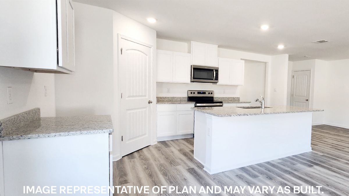 white kitchen island with stainless steel appliances