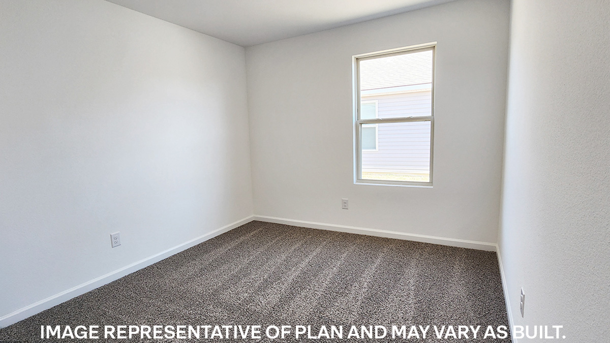 fifth bedroom with window and room for full or queen bed
