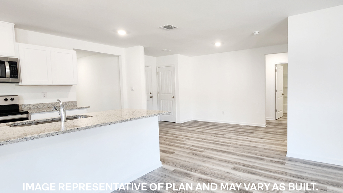 white kitchen island with stainless steel appliances