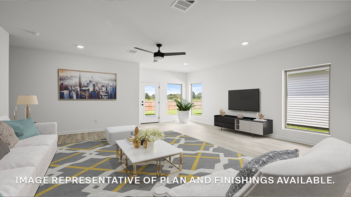spacious living room with dual windows overlooking backyard