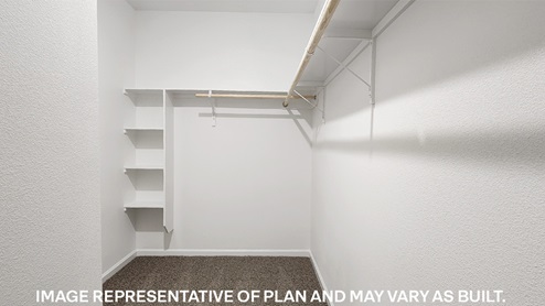 walk-in closet with extra shelving in the primary closet of the cameron plan