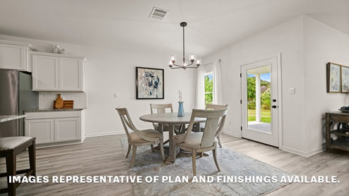 open-concept dining space with access to patio