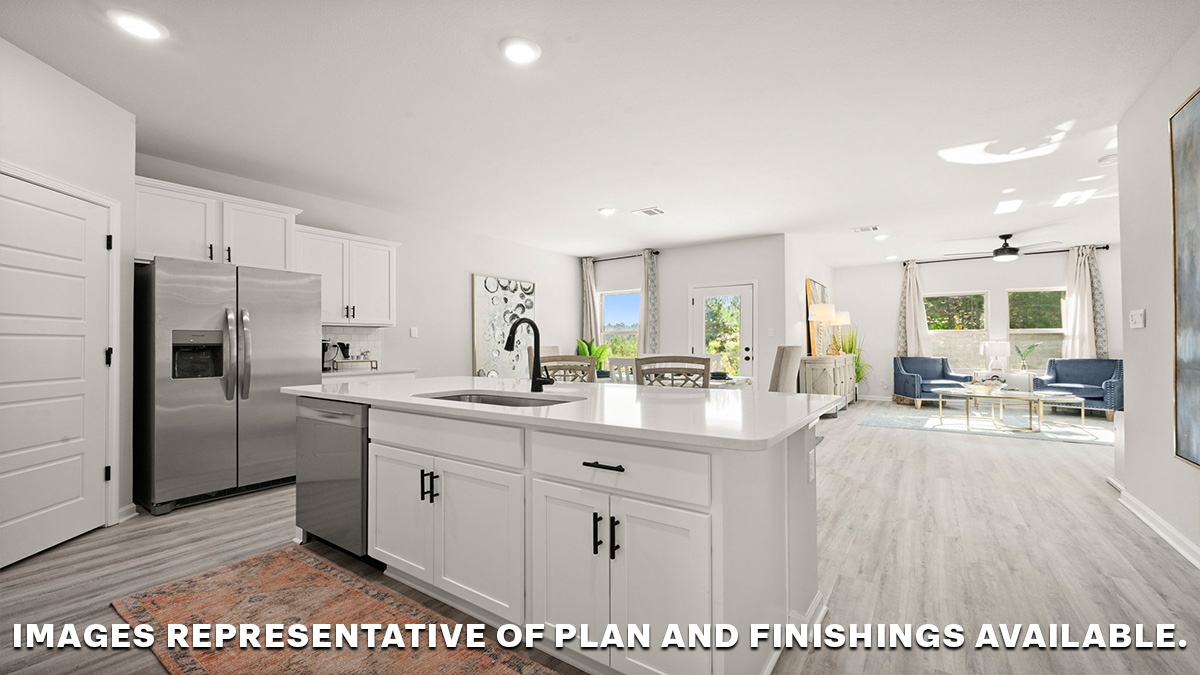 white kitchen island cabinets with stainless steel appliances and access to open-concept living space