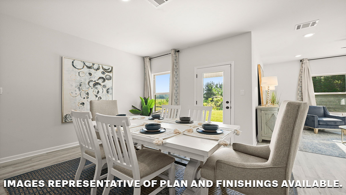 open-concept dining space with access to patio