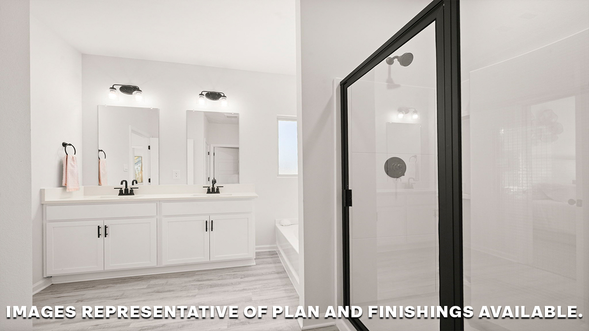 separate shower and dual vanities in primary bathroom