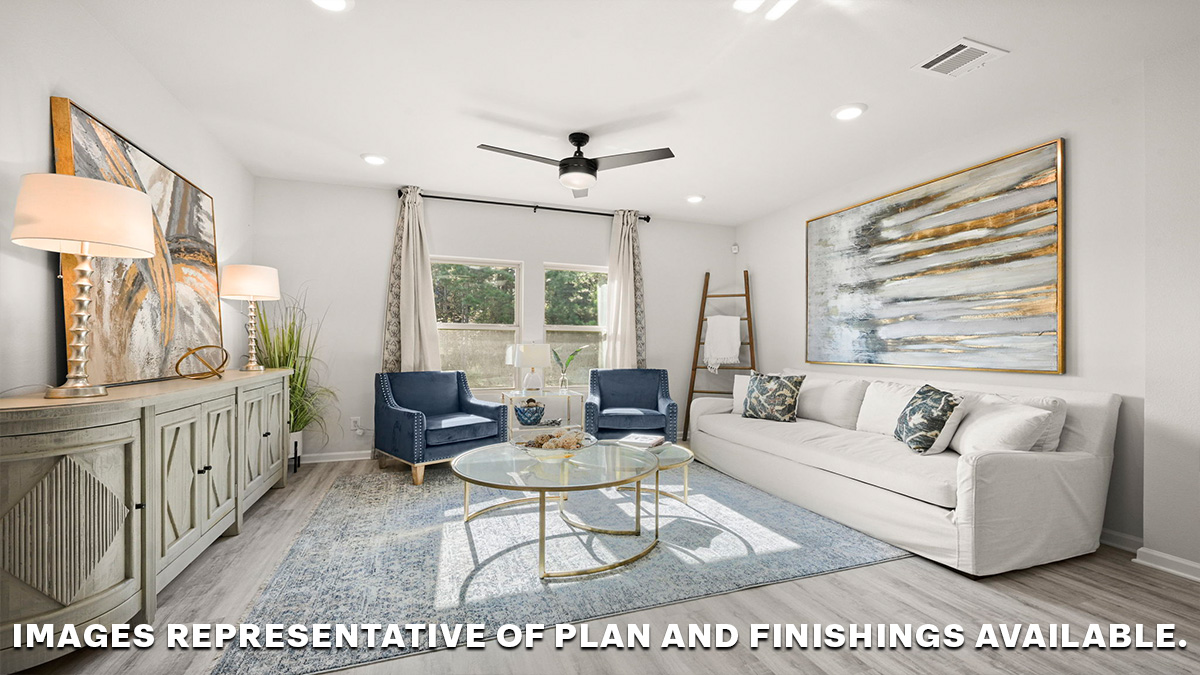 spacious living room with dual windows overlooking backyard