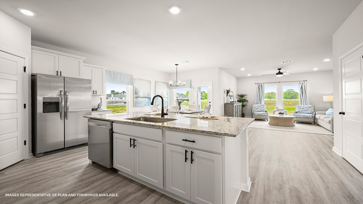 White kitchen island with living and dining room in the rear