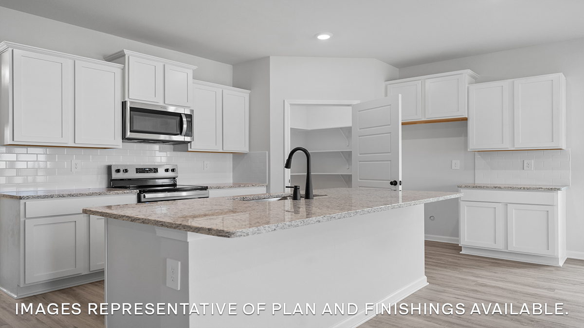 White kitchen island with stainless steel appliances and stools with pantry access