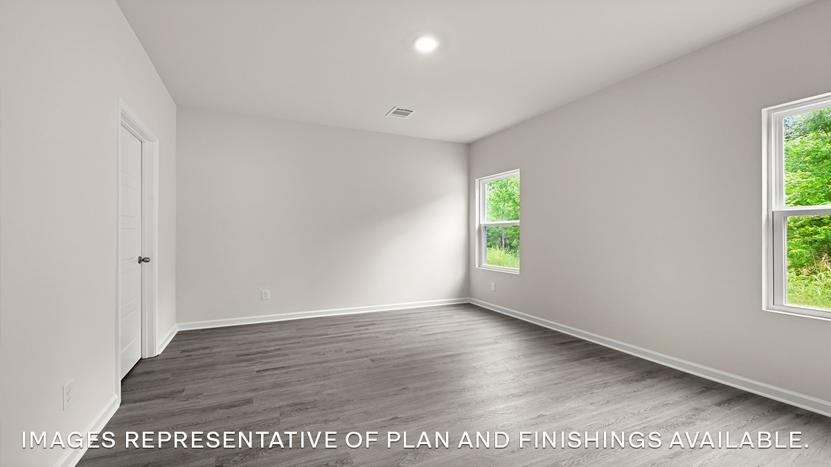 primary bedroom with room for a king-sized bed and rear facing window