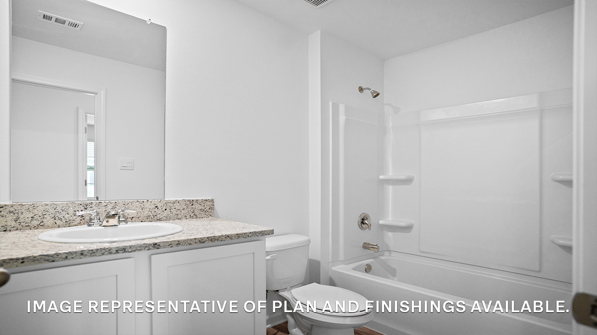 Guest bathroom with single vanity mirror and shower tub combo