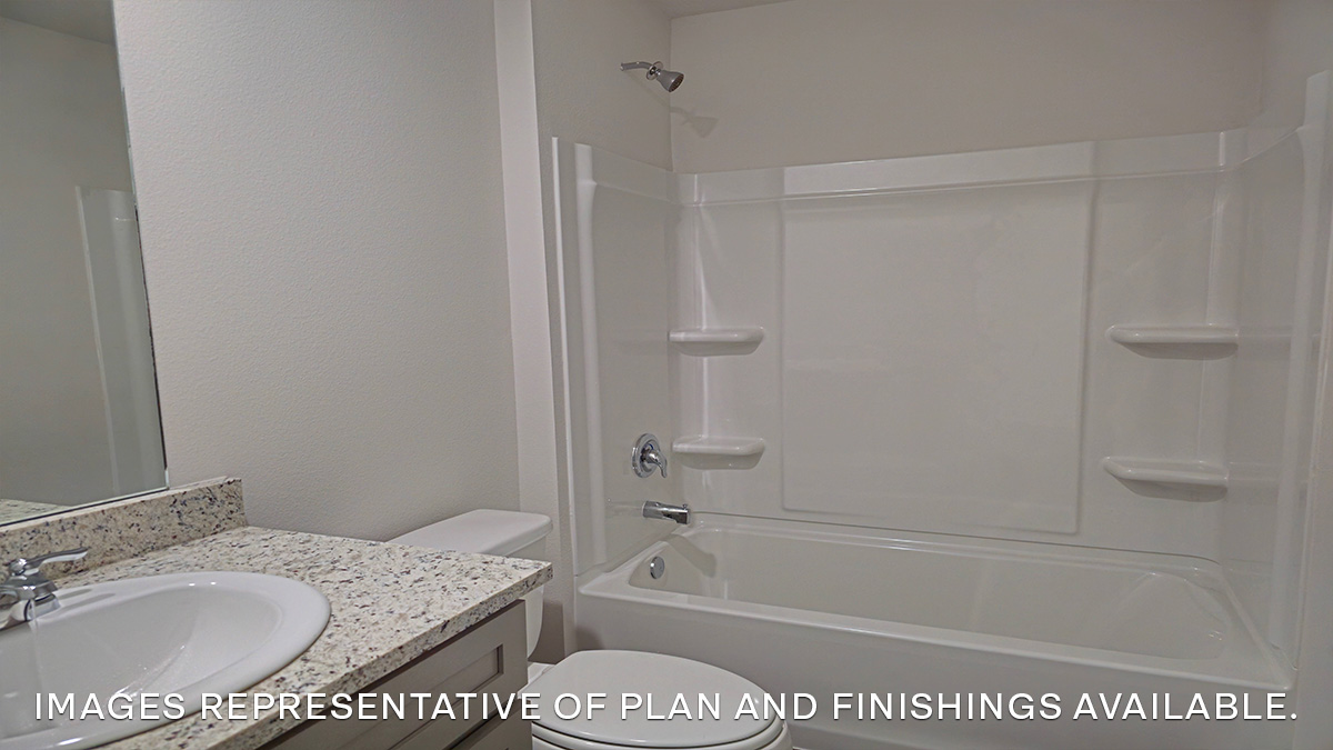 second bathroom with single vanity, toilet and shower tub combo