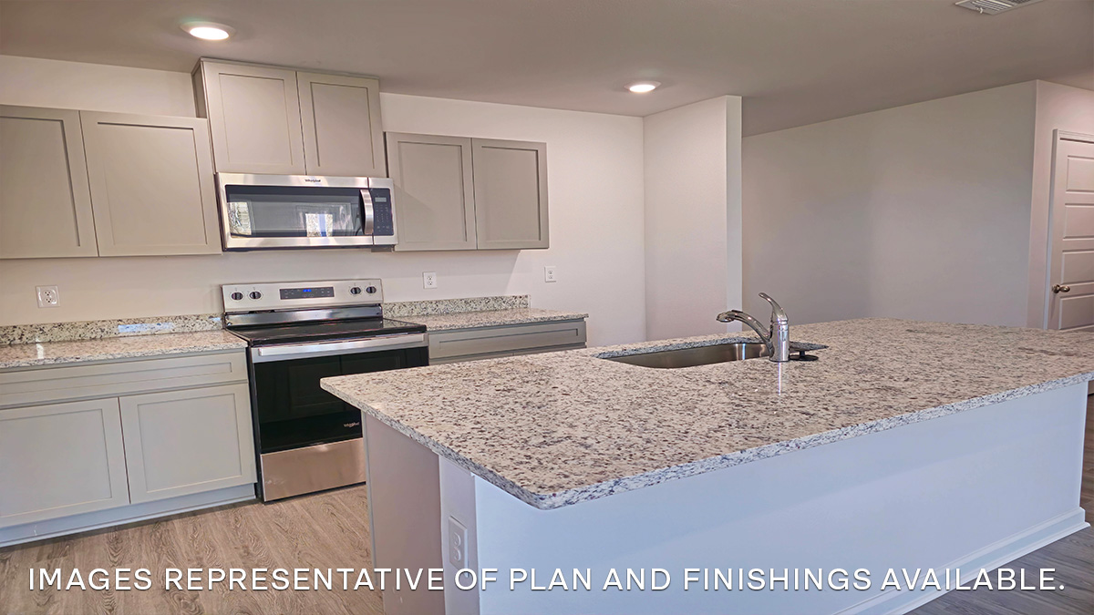 gray kitchen island with stainless steel appliances