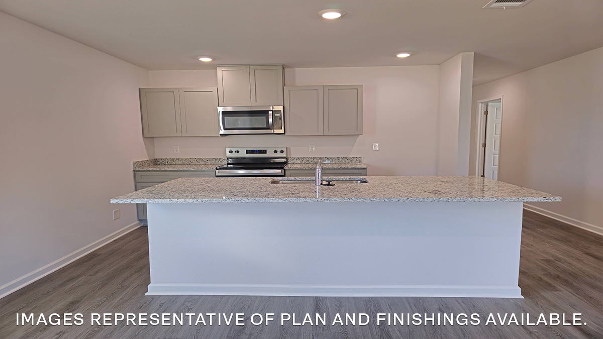 gray kitchen island with stainless steel appliances