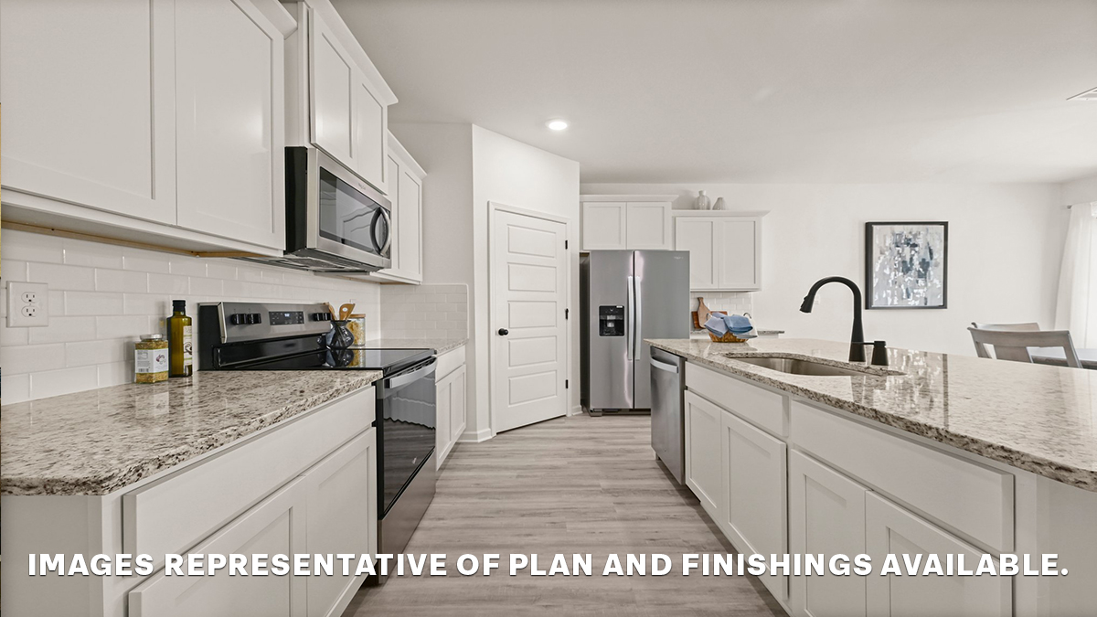 white kitchen island with stainless steel appliances