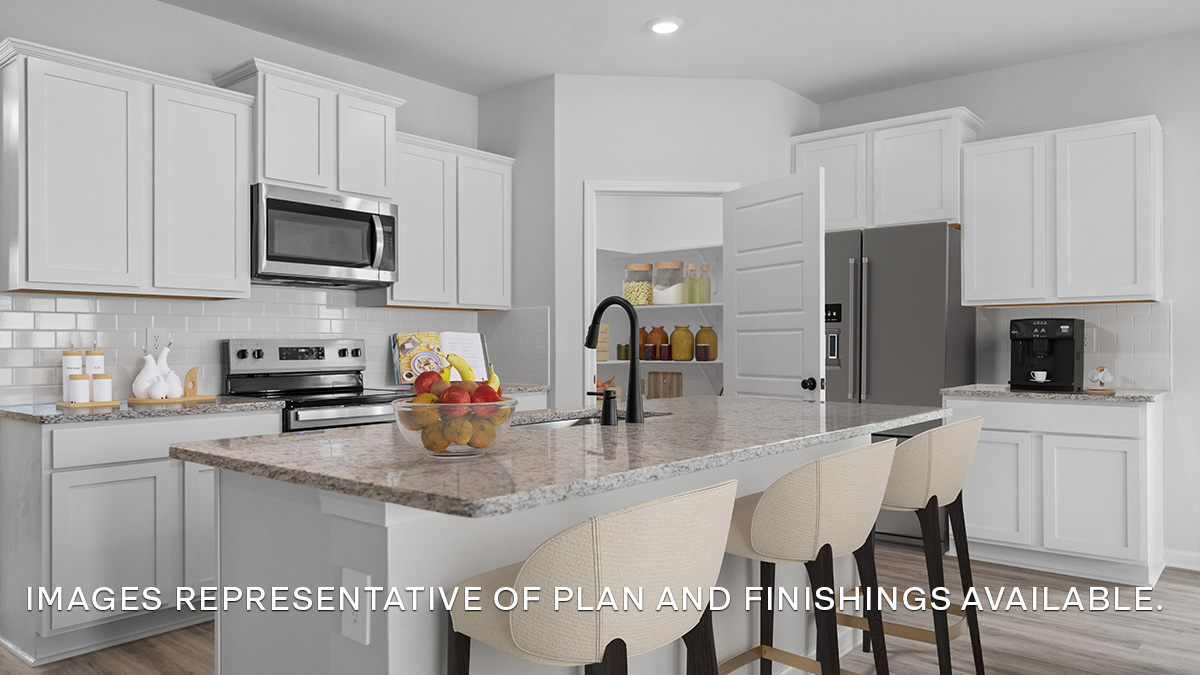 White kitchen island with stainless steel appliances and stools with pantry access