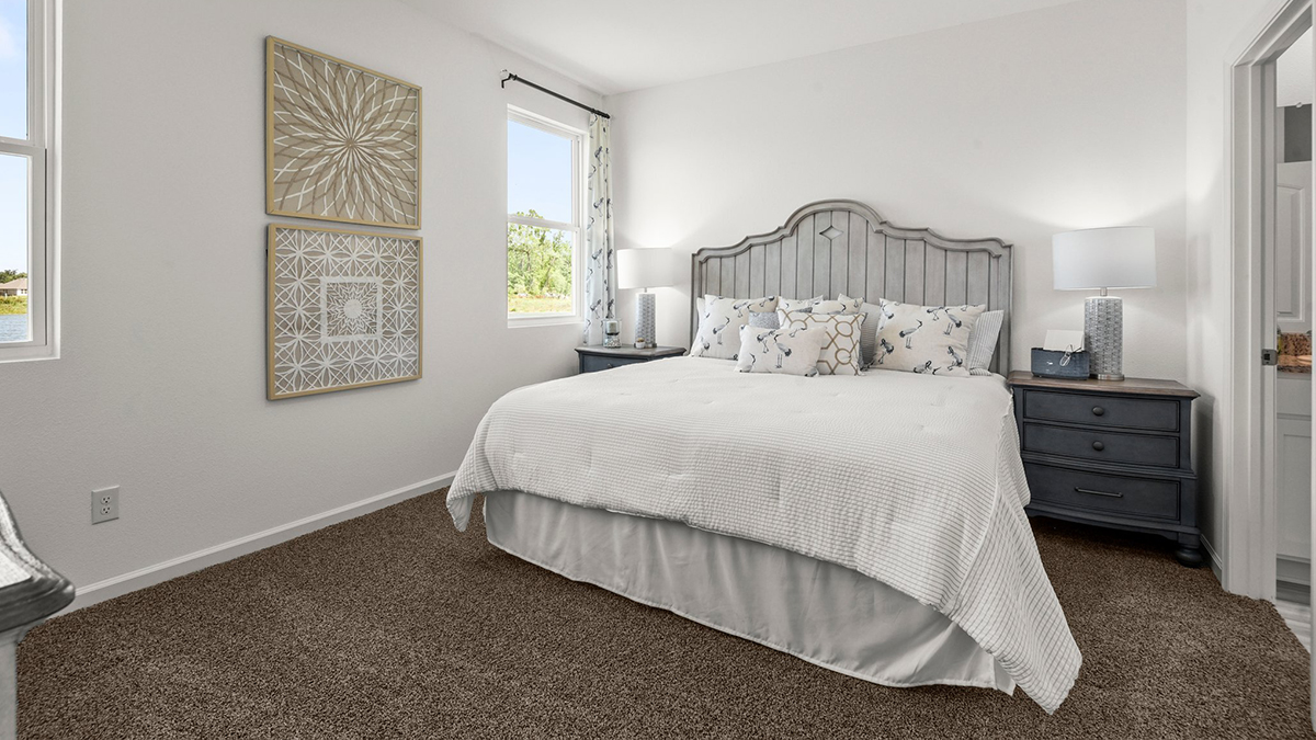 primary bedroom with room for a king-sized bed and rear facing window