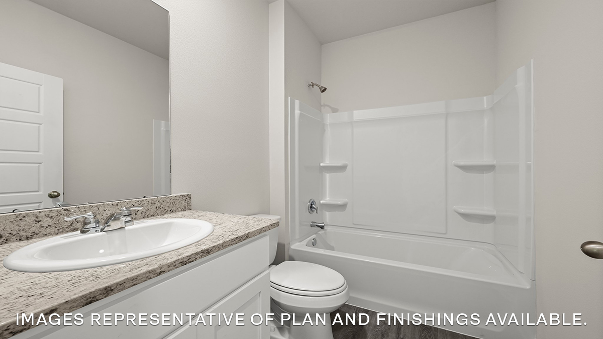 second bathroom with single vanity and toilet and shower tub combo