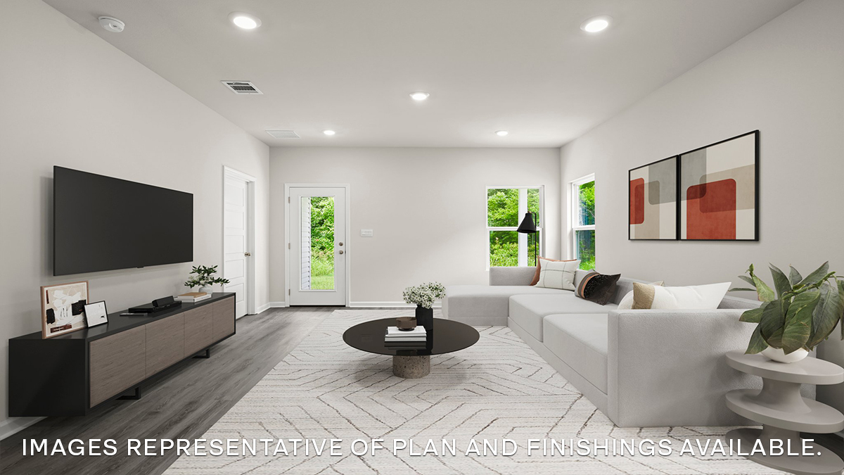 spacious living room with dual windows overlooking backyard