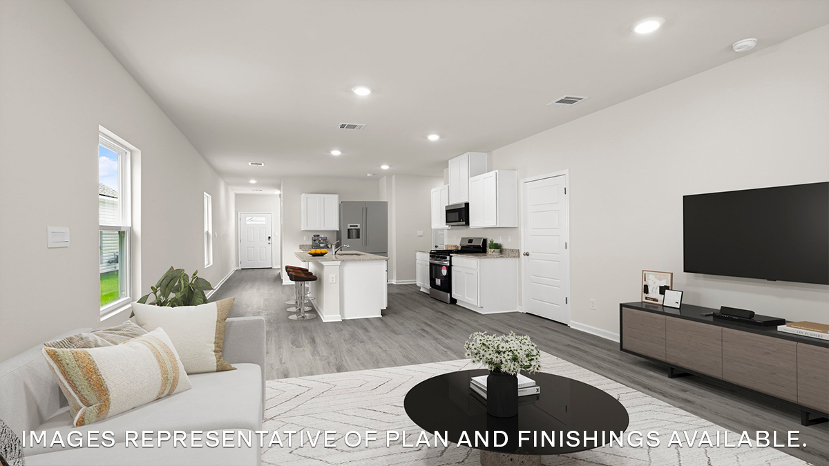 open-concept living room and dining room leading to the kitchen