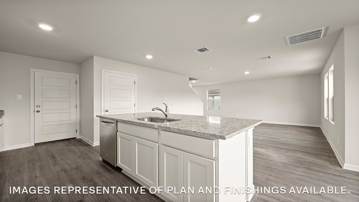 white kitchen island with open living space in the rear