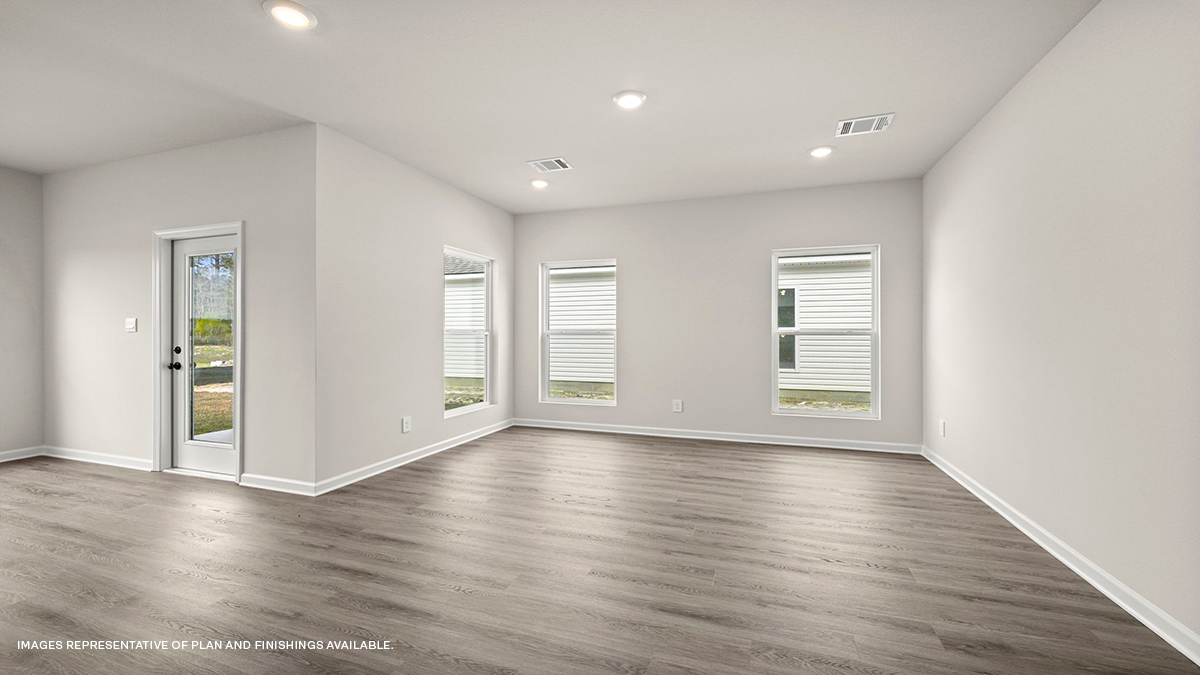 Open-concept living room with dining room and kitchen to the side
