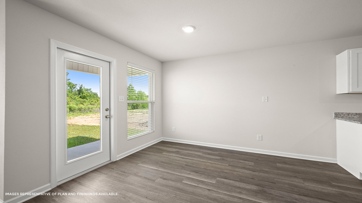 Open-concept dining room with patio access