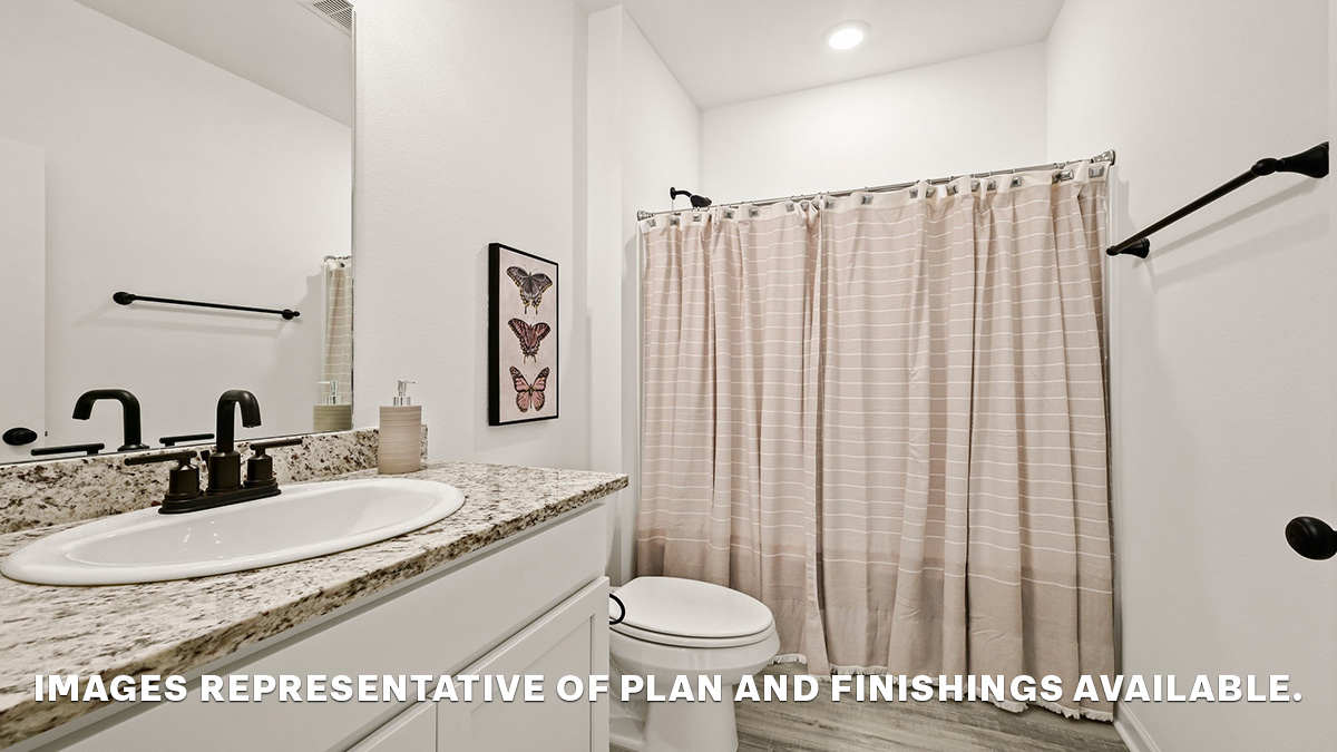 second bathroom with single vanity and toilet and shower tub combo