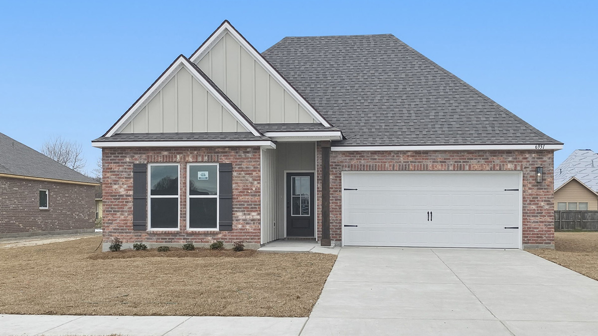 single-story home with brown brick with tan vinyl siding with brown front door and shutters with two-car garage