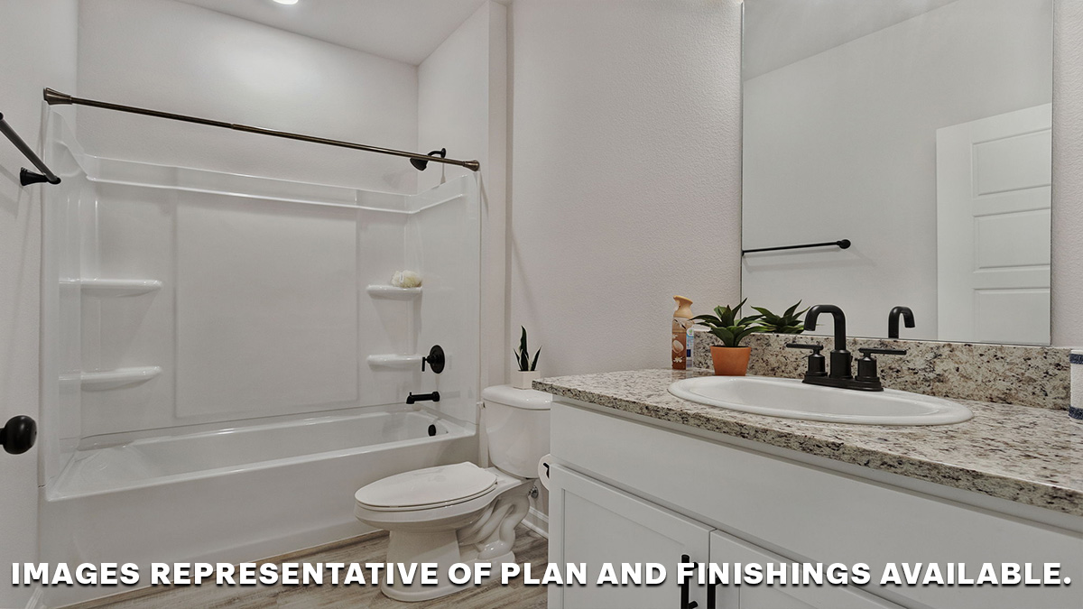 Guest bathroom with single vanity mirror and shower tub combo